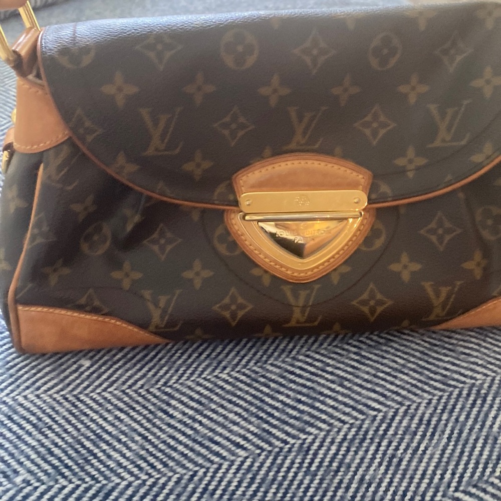 Louis Vuitton handbag, minimally used, clean interior, stud bottom.